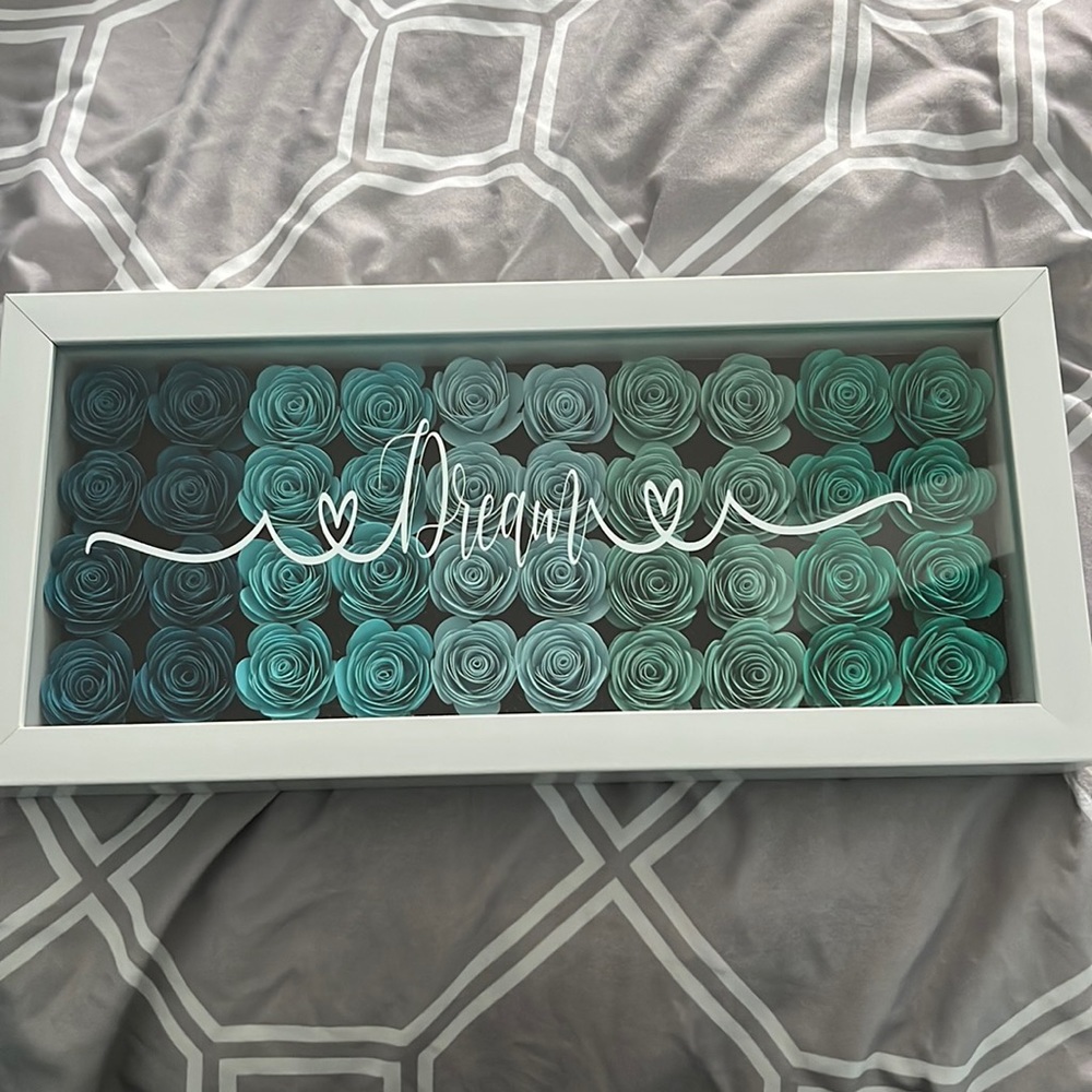 Wall decal that is a shadow box with wooden flowers